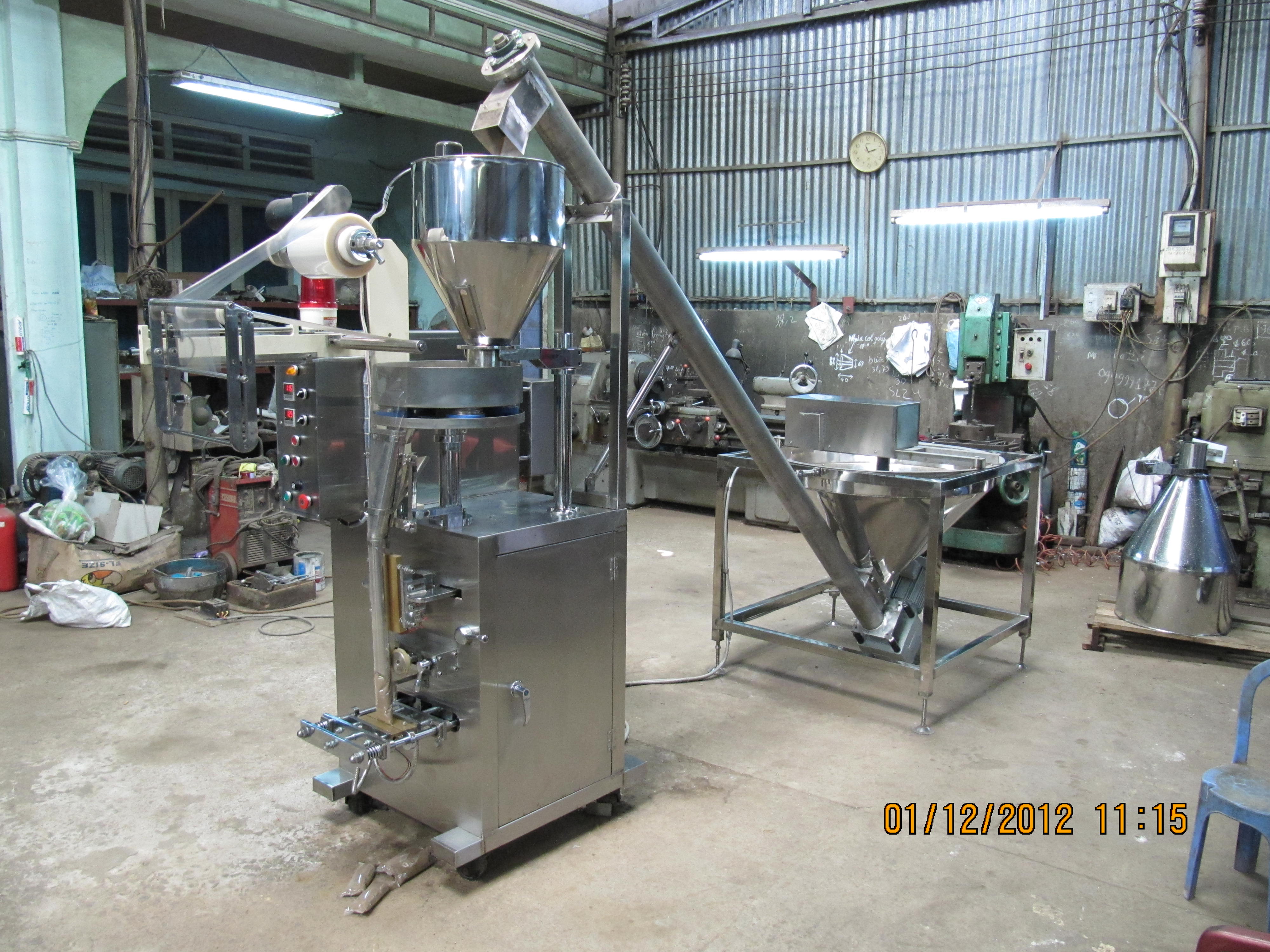 Thiet Bi Dien - Thiet Bi Nhiet - Máy đóng gói đứng cấp liệu tự động 